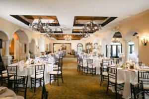 Romantic Indoor Ballroom Reception with Black Chiavari Chairs and Chandeliers | White Linens and Low Blush Pink Dusty Rose Centerpieces | Elegant Tampa Wedding Venue Avila Golf & Country Club