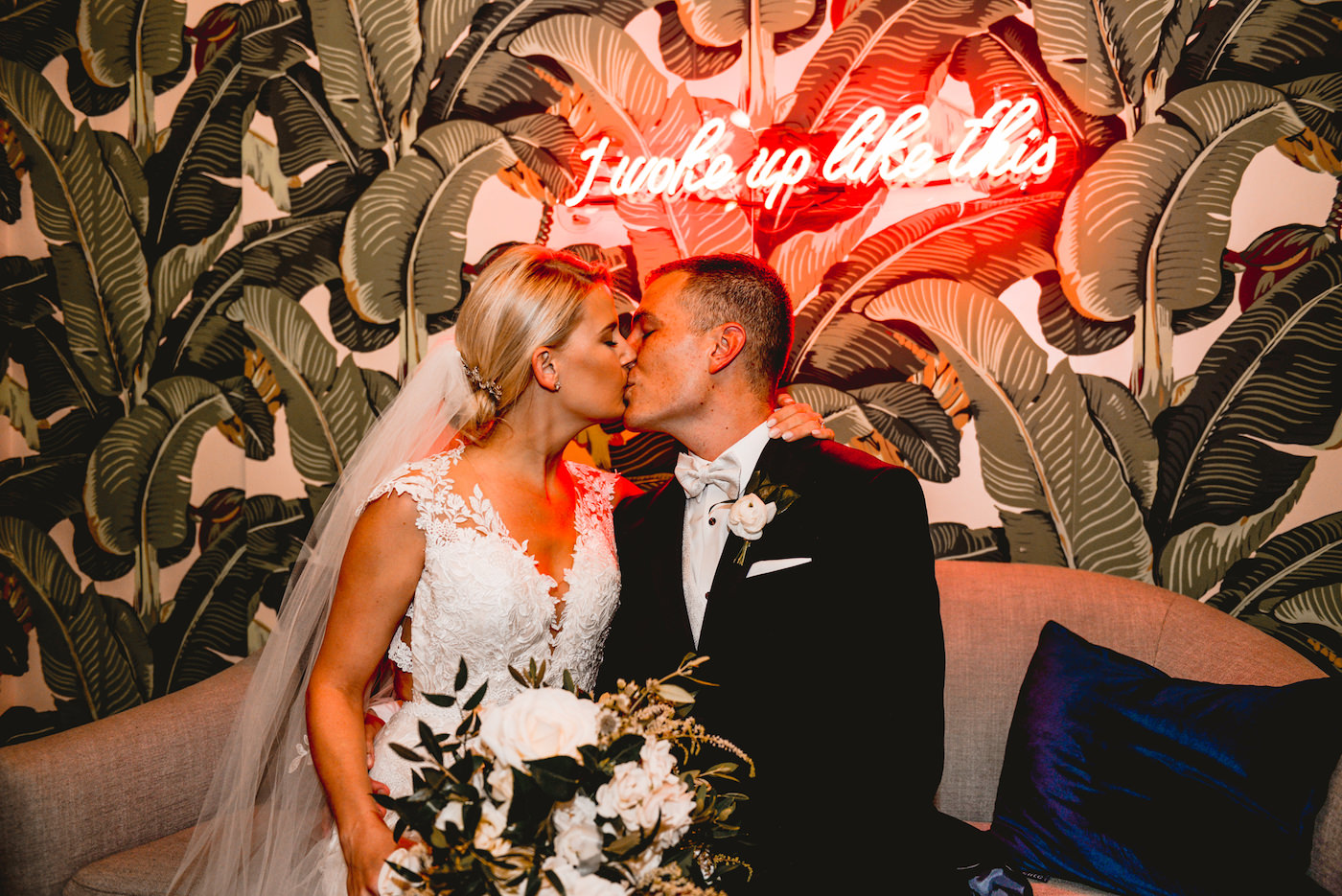 Bride and Groom Portrait with Pattern Wallpaper and Neon Light Backdrop at Unique St. Pete Wedding Venue Station House