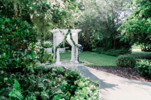 The Tampa Garden Club Tampa Wedding Venue | Garden Wedding Ceremony with Draped Arbor and Greenery