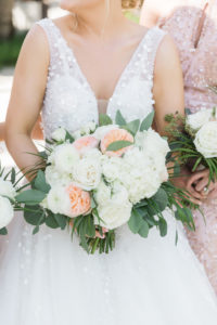Nicole Spose A-Line Wedding Dress with Embellishments | Pastel White and Peach Bouquet