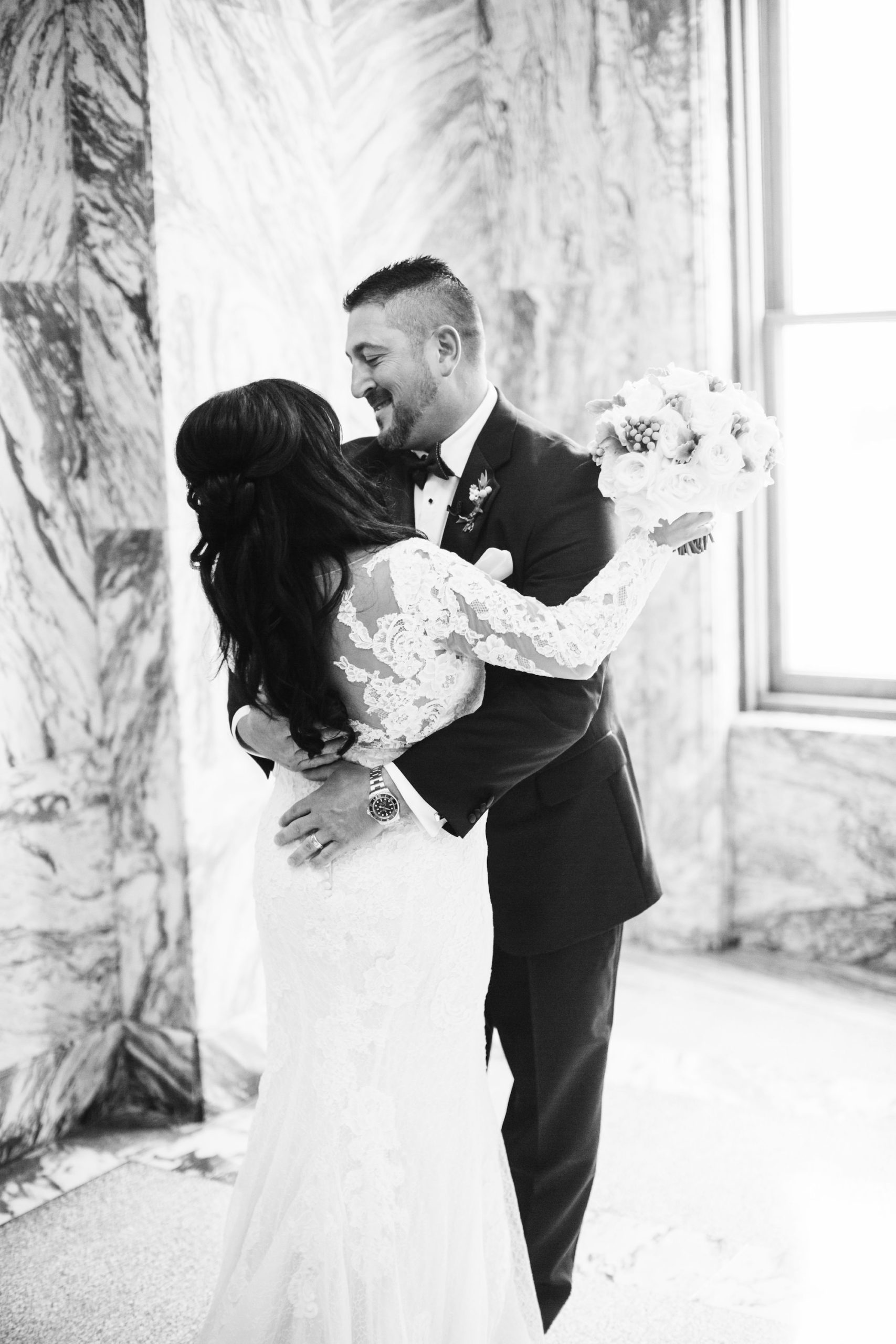 Romantic Bride from Parties A'la Carte and Groom Black and White First Look Wedding Portrait at Historic Courthouse Tampa Wedding Venue Le Meridien