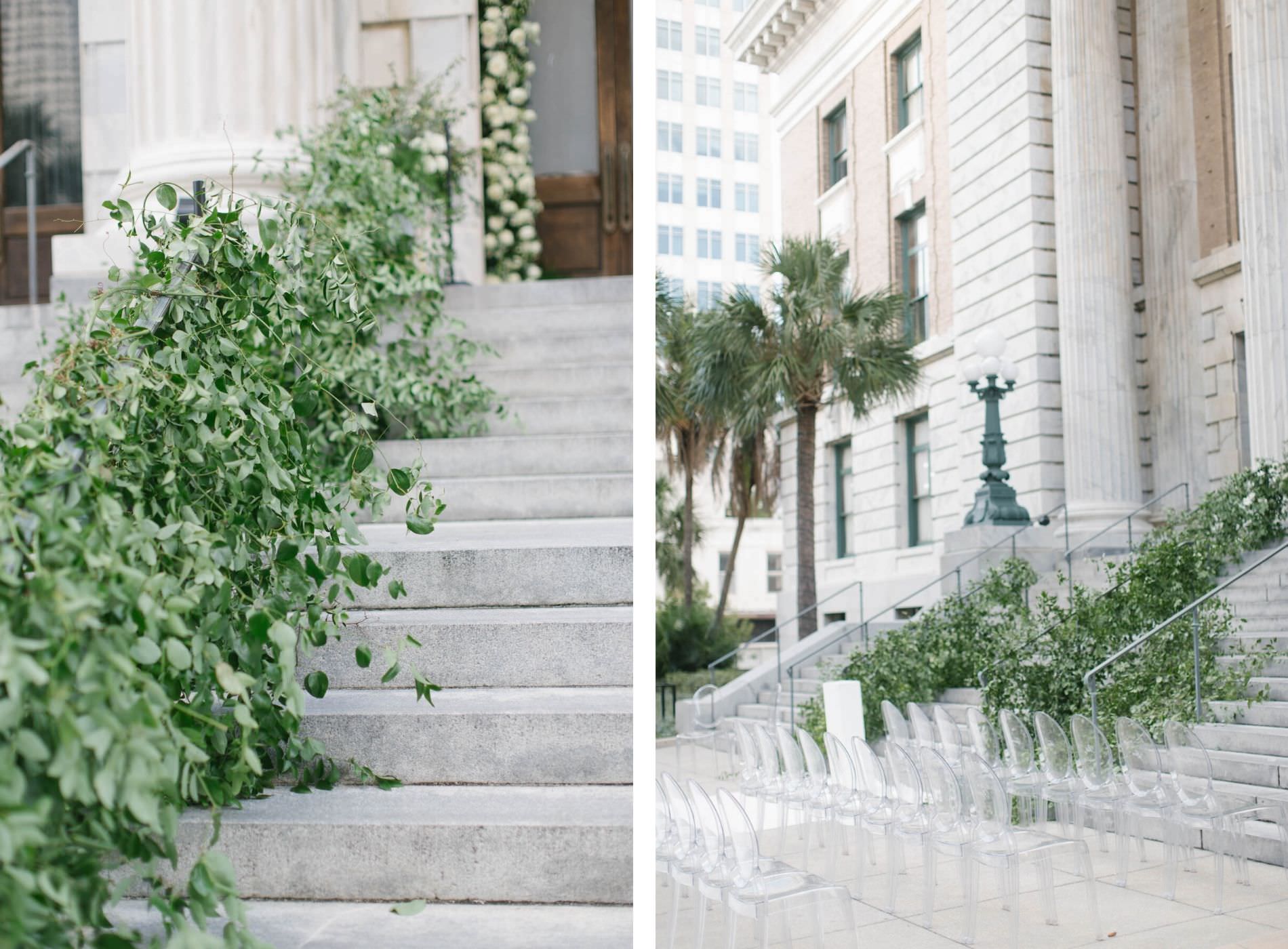 Garden Inspired Wedding Ceremony Decor on Stairs at Historic Downtown Courthouse Hotel Wedding Venue Le Meridien Tampa, Ghost Acrylic Chairs | Wedding Planner Parties A'la Carte | Wedding Rentals A Chair Affair