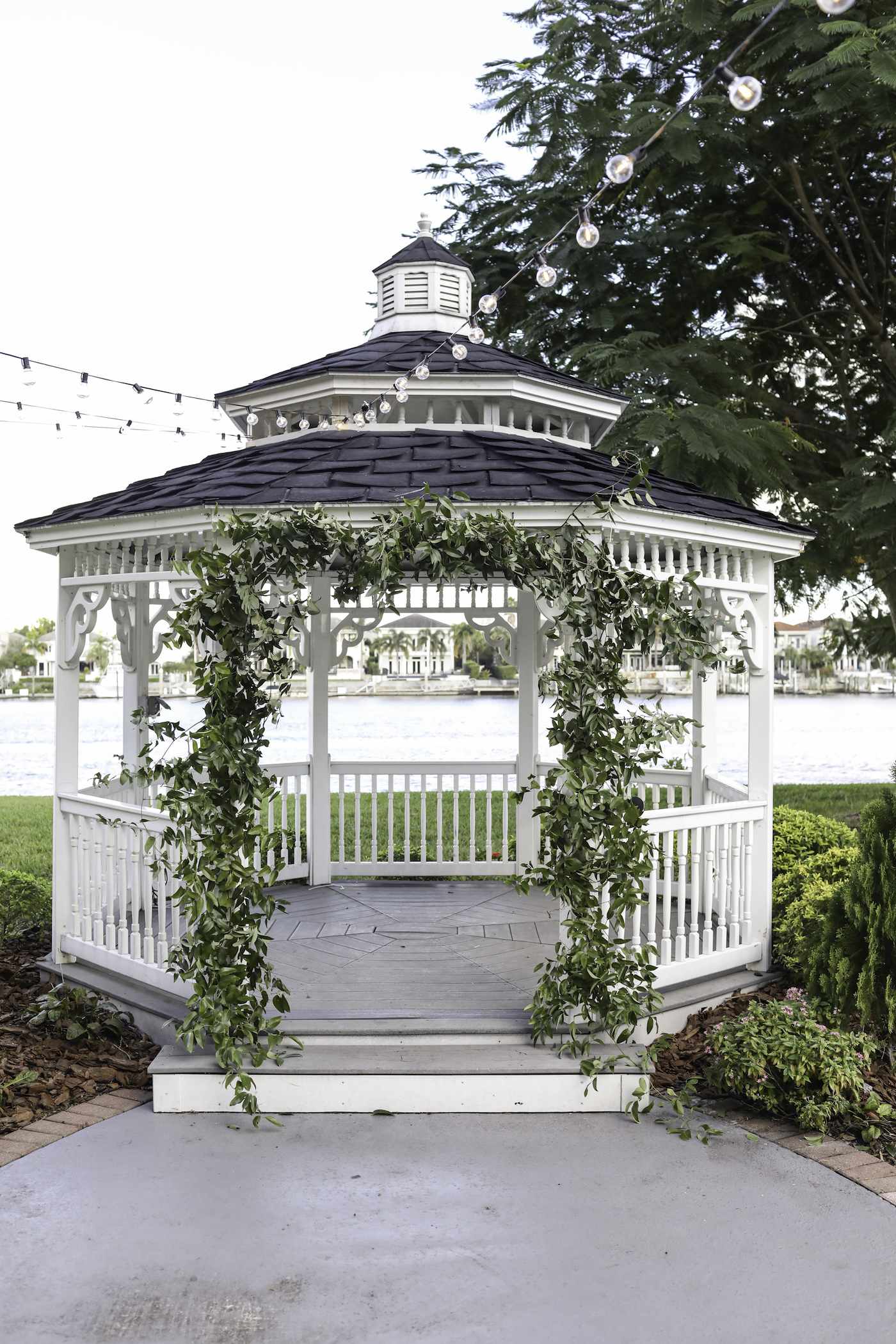 Greenery Arch on White Waterfront Gazebo | Wedding Photographer Lifelong Photography Studio | Wedding Planner Blue Skies Weddings and Events | Tampa Wedding Venue Davis Islands Garden Club
