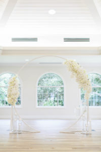 Classic Church Wedding Ceremony Decor, Circular Arch with White Floral Arrangements | Tampa Bay Wedding Planner Parties A'la Carte | Safety Harbor Wedding Venue Harborside Chapel