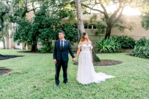 Bride and Groom Wedding Portraits | Tampa Garden Club Tampa Wedding Venue | Groom in Classic Black Suit Tux | Off The Shoulder Lace Applique Sweetheart Ballgown Wedding Dress