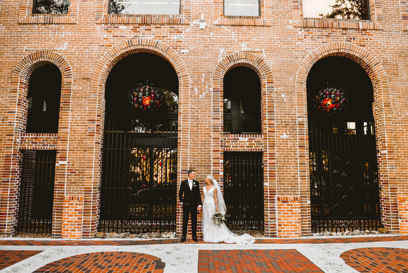 Bride and Groom Downtown St. Pete Wedding Portraits with Brick Wall Backdrop