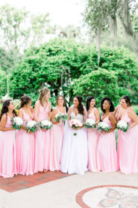 Florida Bride and Bridesmaids in Matching Pink Dresses Holding White and Pink Rose Floral Bouquets | Tampa Wedding Photographer Shauna and Jordon Photography | Wedding Dress Truly Forever Bridal