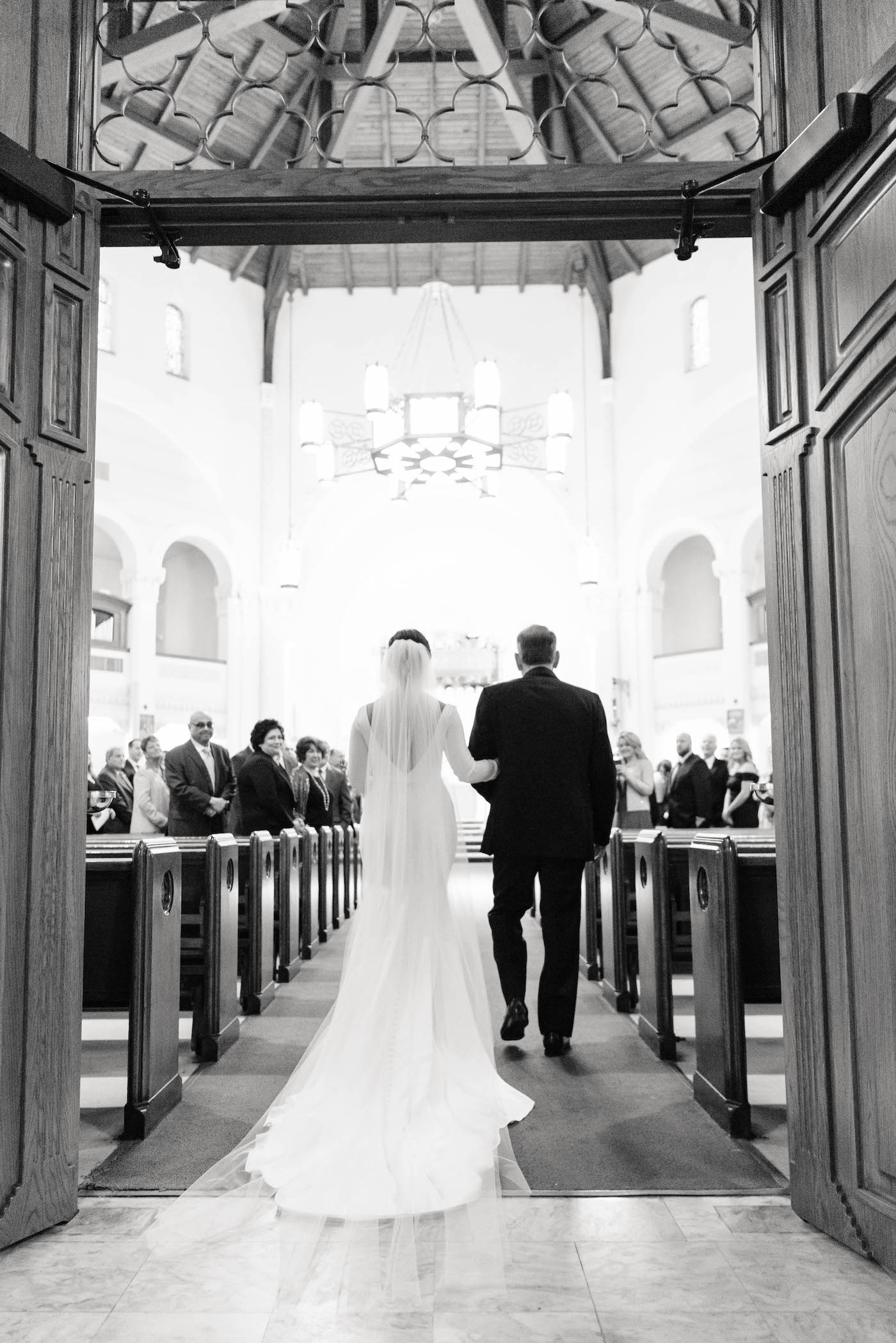 Florida Bride and Father Walk Down the Aisle in Traditional Wedding Processional | Black and White Wedding Ceremony Portrait | St. Mary Our Lady of Grace Catholic Church in St. Petersburg | Tampa Bay Wedding Planner Parties A'La Carte