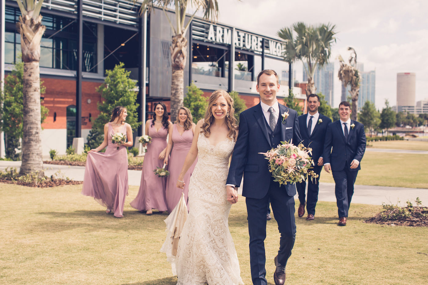 Tampa Wedding Party Outdoor Portraits at Tampa Downtown Historic Venue Armature Works | Dusty Rose Bridesmaid Dresses and Navy Blue Groomsmen Suits | Tampa Wedding Photographer Luxe Light Images
