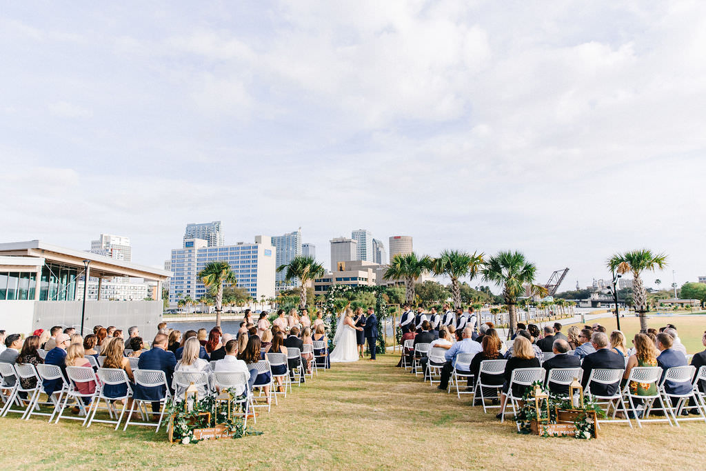 Timeless Downtown Tampa Waterfront Wedding Ceremony, Outdoor Florida Wedding with Tampa Skyline as Backdrop at Tampa River Center | Florida Luxury Wedding Planner UNIQUE Weddings and Events