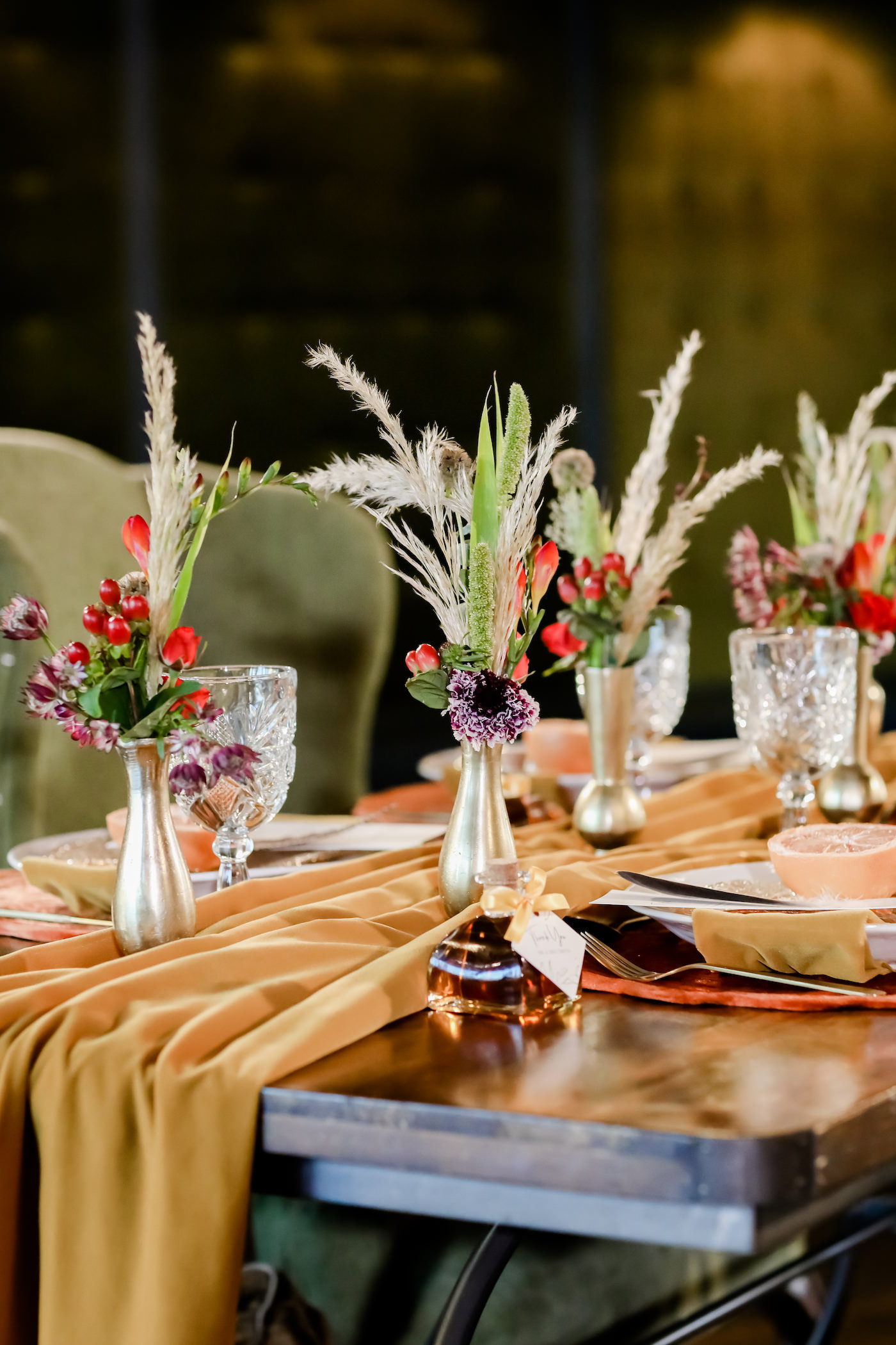 Bohemian Inspired Tampa Bay Wedding Reception and Decor, Autumn Colors, Mustard Yellow Flowy Table Runner, Low Floral Centerpieces in Pewter Vases, with Deep Red, Purple, and Eggplant Flowers, Greenery with Pampas Grass, Custom Honey Thank You Gift, Crystal Glasses | Unique Tampa Bay Wedding Venue Station House in DTSP | Downtown St. Petersburg Wedding Planner Blue Skies Weddings and Events | Florida Wedding Photographer Lifelong Photography Studio