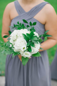 Classic Bridesmaid Wearing Long Dark Slate Gray Watters Dress, Holding Ivory Roses and White Floral Bouquet | Tampa Bay Wedding Planner Parties A La Carte | Downtown St. Pete Wedding Florist Bruce Wayne Florals | South Tampa Bridesmaids Dress Boutique Bella Bridesmaids