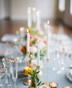 Romantic Wedding Decor at Reception, Low Floral Centerpieces with Peach, Pink and Yellow Roses, Greenery, Decorative Crystal Chargers with Flatware, Tall Taper Candles with Gold Accents | Florida Wedding Planner Kelly Kennedy Weddings and Events | Kate Ryan Event Rentals
