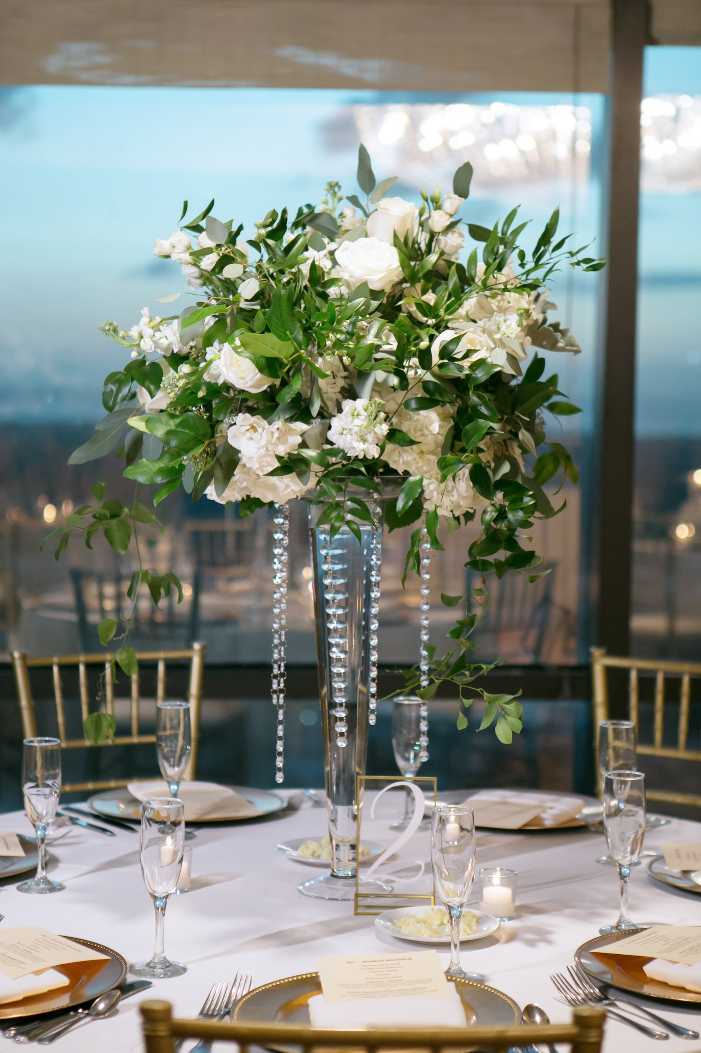 Classic Timeless Wedding Reception Decor, Tall Greenery Leaves and White Roses, Hydrangeas Floral Centerpiece with Hanging Crystals | Wedding Photographer Carrie Wildes Photography
