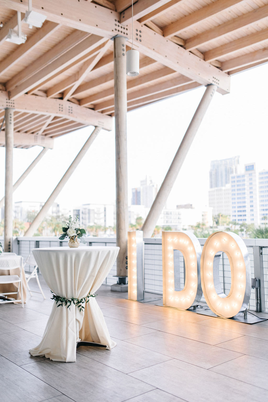 Timeless Tampa Bay Wedding Reception and Decor, Outdoor Waterfront Cocktail Hour with "I DO" Lights at Tampa River Center | Florida Wedding Planner UNIQUE Weddings and Events | A Chair Affair | Over The Top Linen Rentals