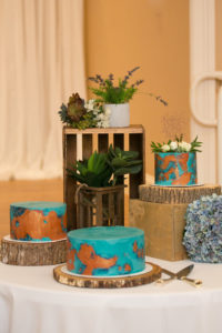 Unique Wedding Cakes, Three Separate One Tier Blue Teal and Copper Painted Wedding Cakes on Rustic Wood Stands, Succulents Decor | Wedding Photographer Carrie Wildes Photography