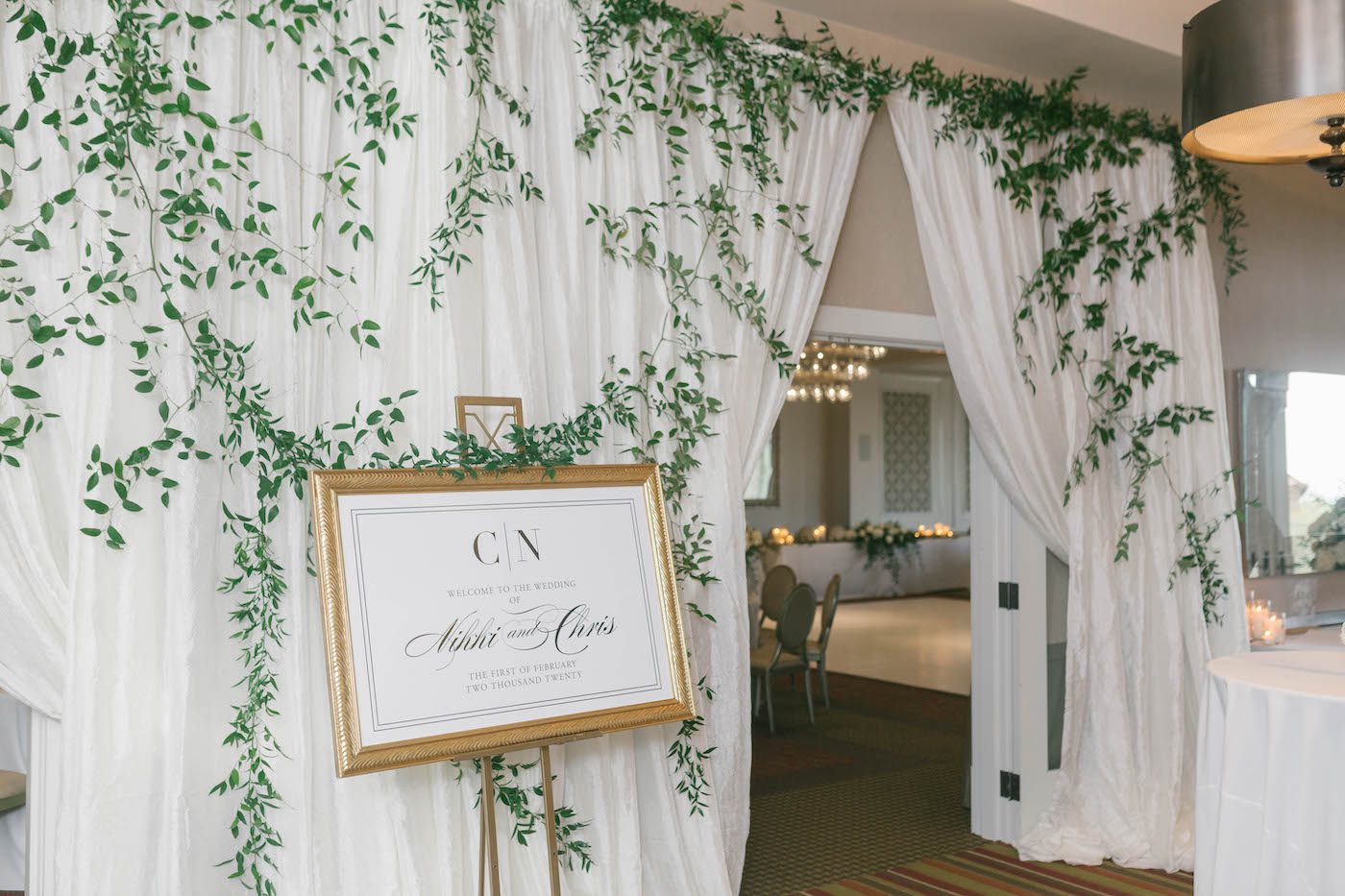 Elegant Wedding Reception Decor, Classic White Draping with Ivy Floral Accents and Greenery, Timeless White and Gold Welcome Sign with Modern Monogram | Tampa Bay Wedding Planner Parties A'La Carte | Florida Boutique Hotel Wedding Venue The Birchwood | Downtown St. Petersburg Wedding Florist Bruce Wayne Florals