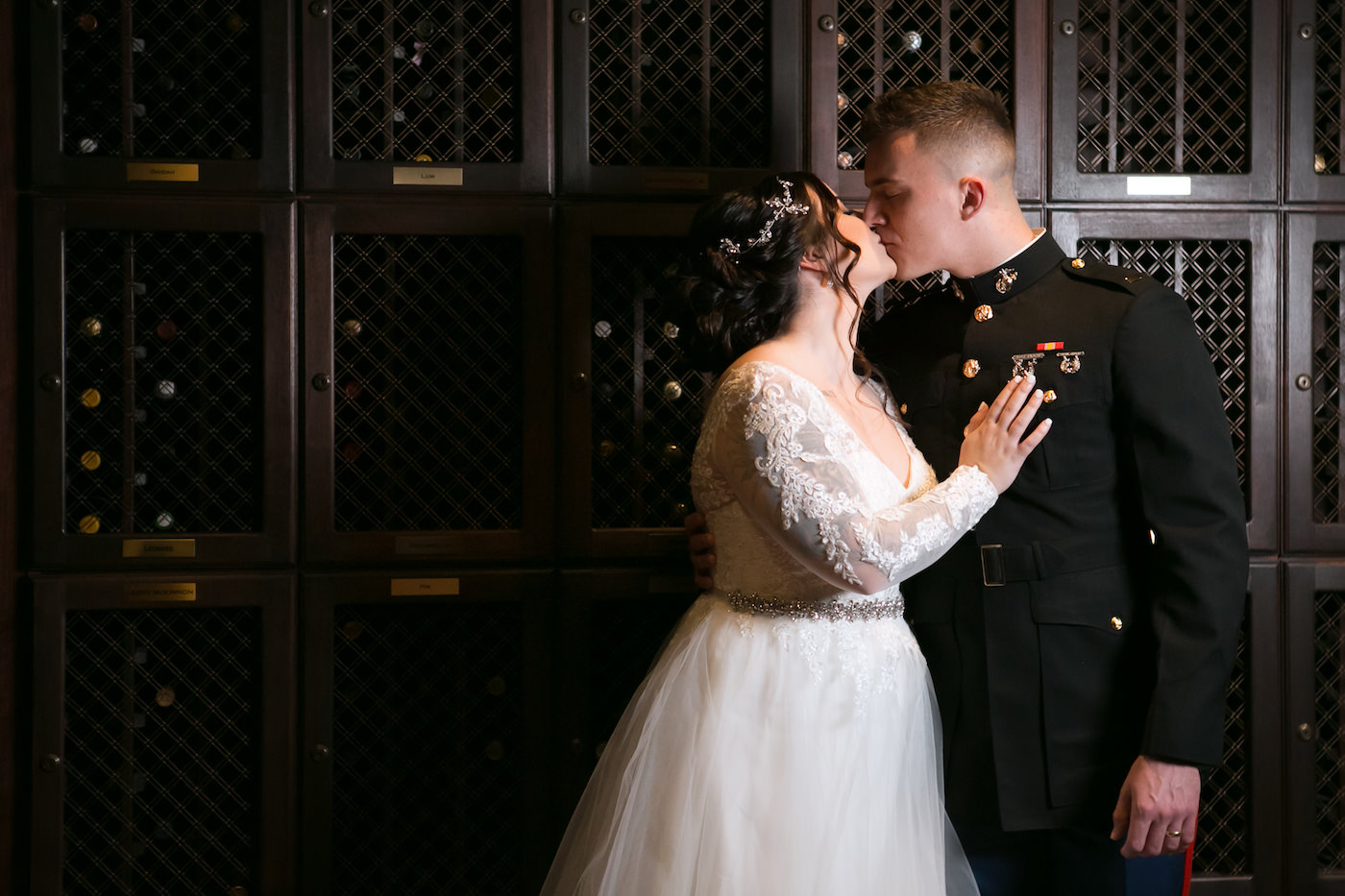 Romantic Classic Tampa Bride and Military Groom Kissing Wedding Portrait in Wine Cellar | Wedding Photographer Carrie Wildes Photography | Wedding Venue The Tampa Club