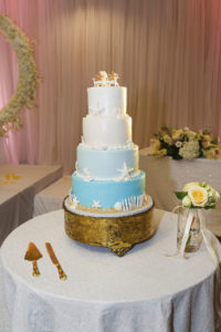 Four Tier Beach Themed Blue and White Ombre Cake Decorate with Seashells