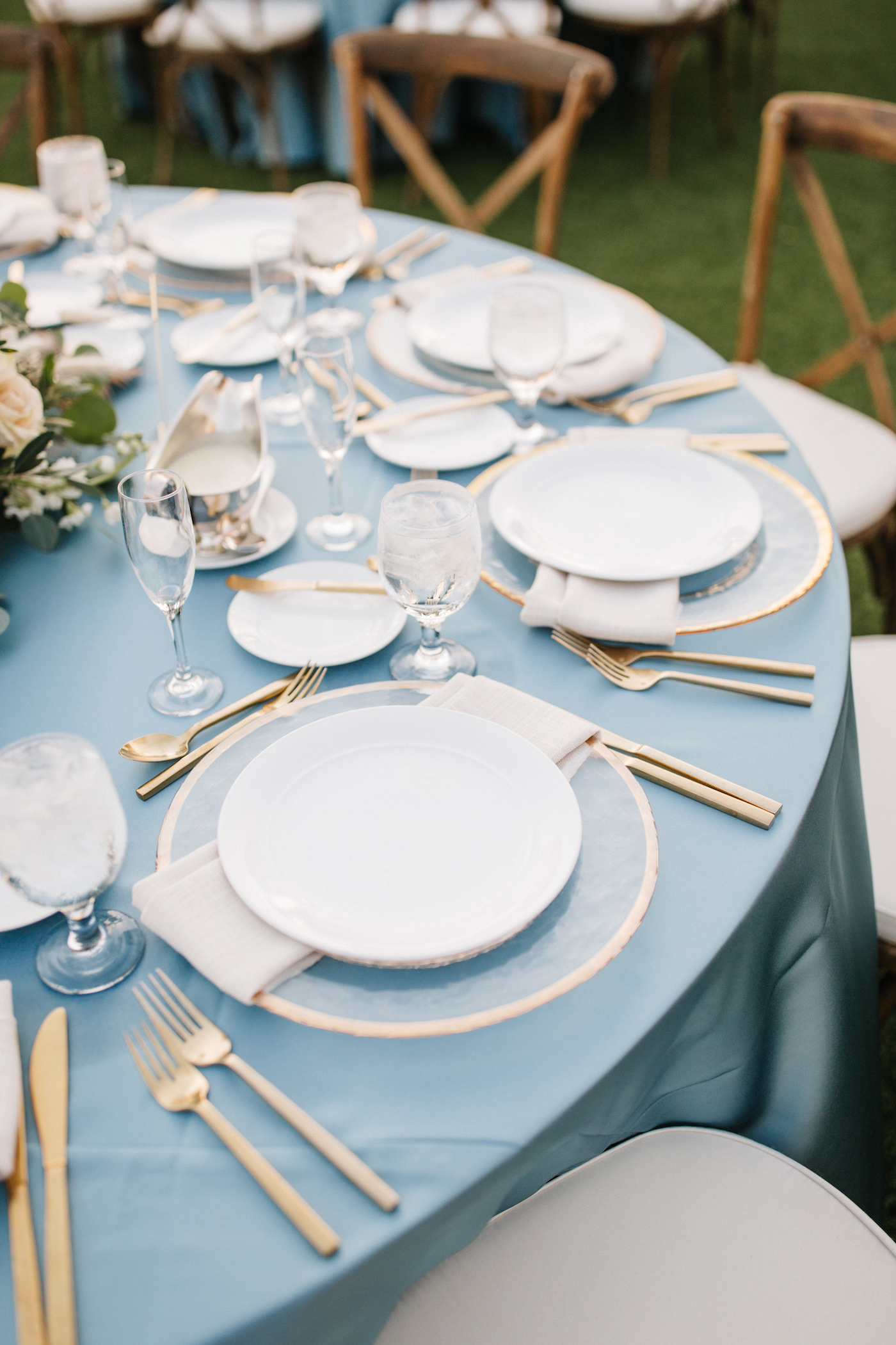Modern, Bohemian Boho Chic Wedding Reception and Decor, Low Floral Centerpieces, Clear Chargers with Gold Rim and Gold Flatware, SDusty Blue Table Linen | Downtown St. Pete Wedding Planner Parties A’ La Carte | Florida Wedding Rental Company Over the Top Rental Linens, A Chair Affair