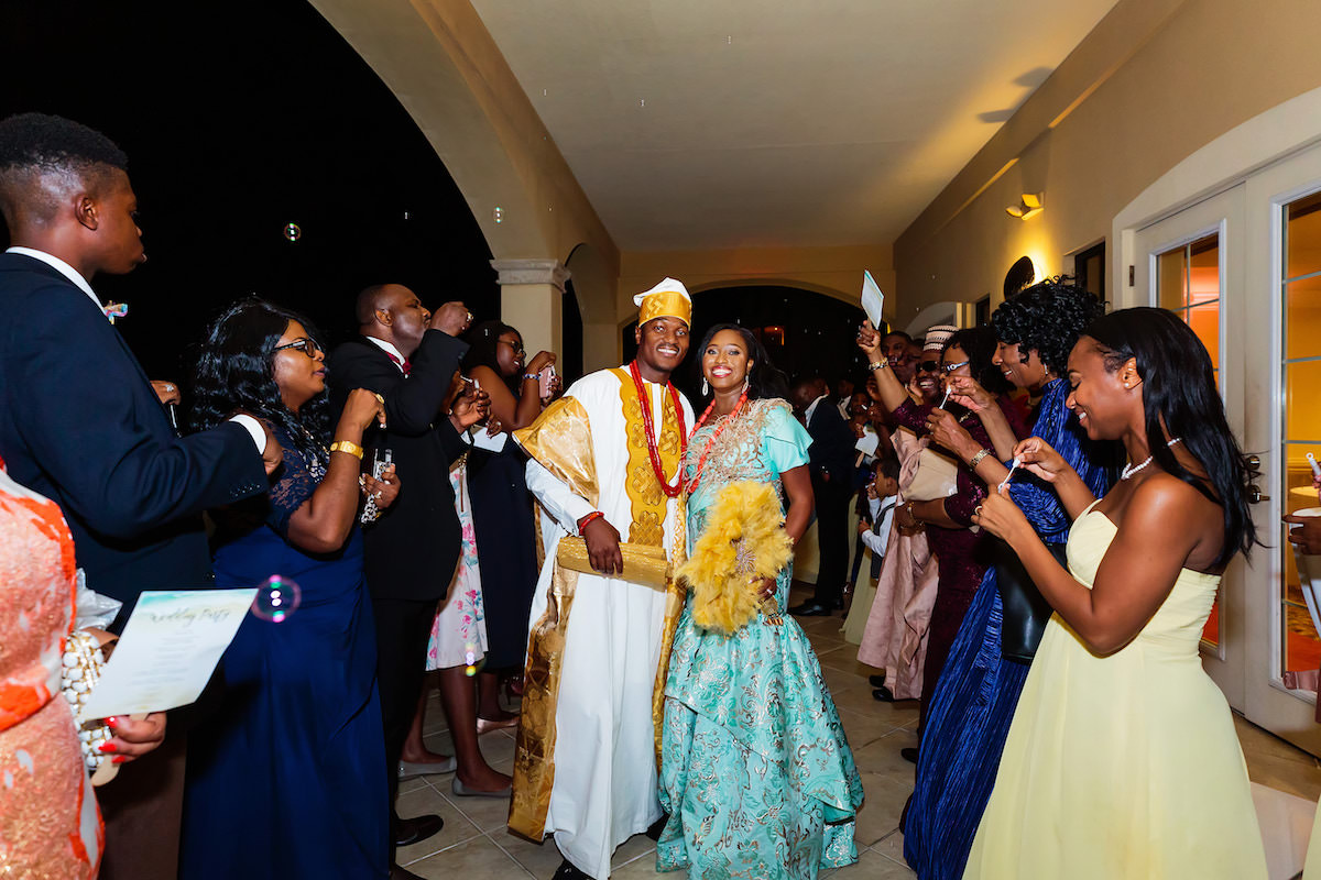 Traditional Bride and Groom in Colorful African Dress Attire Wedding Reception Exit Portrait