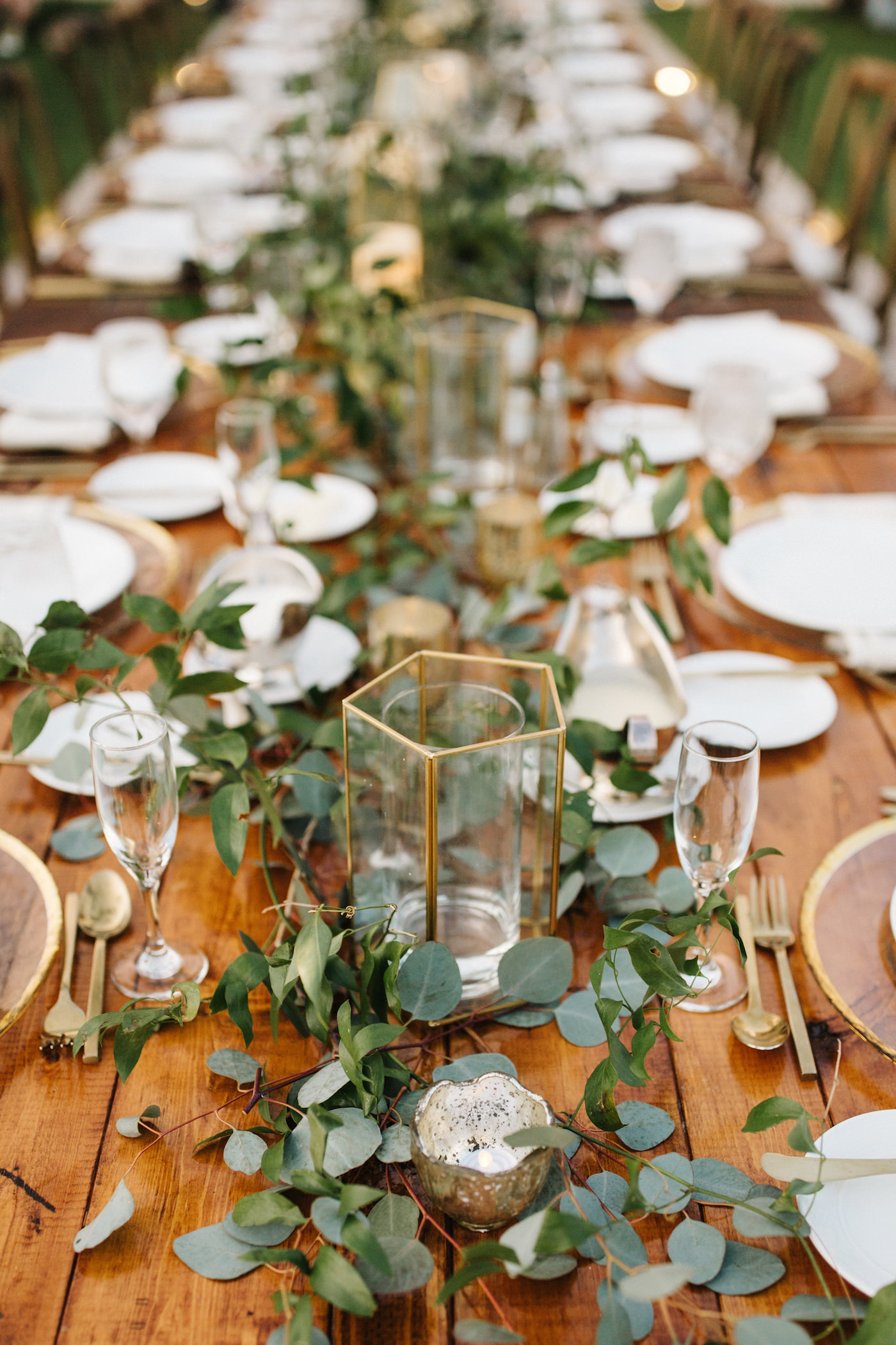Bohemian Beach Inspired Wedding Reception and Decor, Wedding Party Farmhouse Feasting Table with Greenery Eucalyptus Garland Centerpieces, Geometric Modern Vases | Tampa Bay Luxury Wedding Planner Parties A’ La Carte | Rentals A Chair Affair and Over the Top Rental Linens