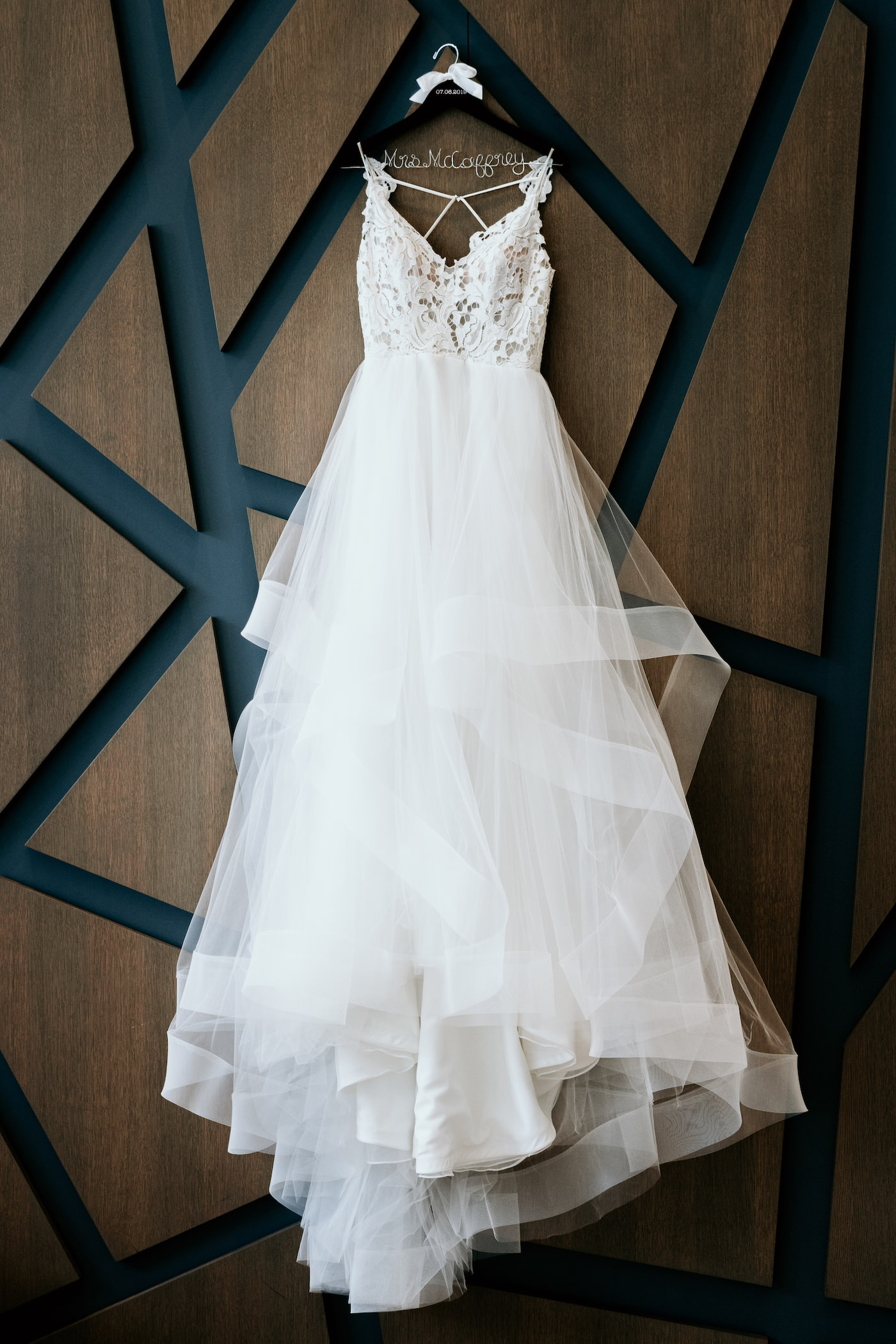 Romantic, Modern White A Line Lace Bodice and Tulle Skirt Wedding Dress Hanging on Art Deco Wall at Hyatt Place Hotel St. Petersburg Downtown | Florida Wedding Photographer Bonnie Newman Creative