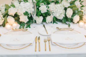 Classic Elegant Wedding Reception Decor, Gold Beaded Rim Chargers, Gold Flatware, White Roses, Hydrangeas and Greenery Lush Floral Arrangement | Tampa Bay Wedding Planner Parties A'la Carte | Wedding Rentals A Chair Affair