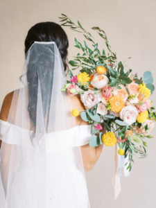 Florida Bride in Sophisticated Off The Shoulder White Wedding Dress with Beaded Veil, Holding Romantic Bridal Bouquet with Vibrant Floral Stems, Pink Roses, Peach Carnations, Yellow Flowers, Light Blue Ribbon Accent, Eucalyptus | Florida Wedding Planner Kelly Kennedy Weddings and Events