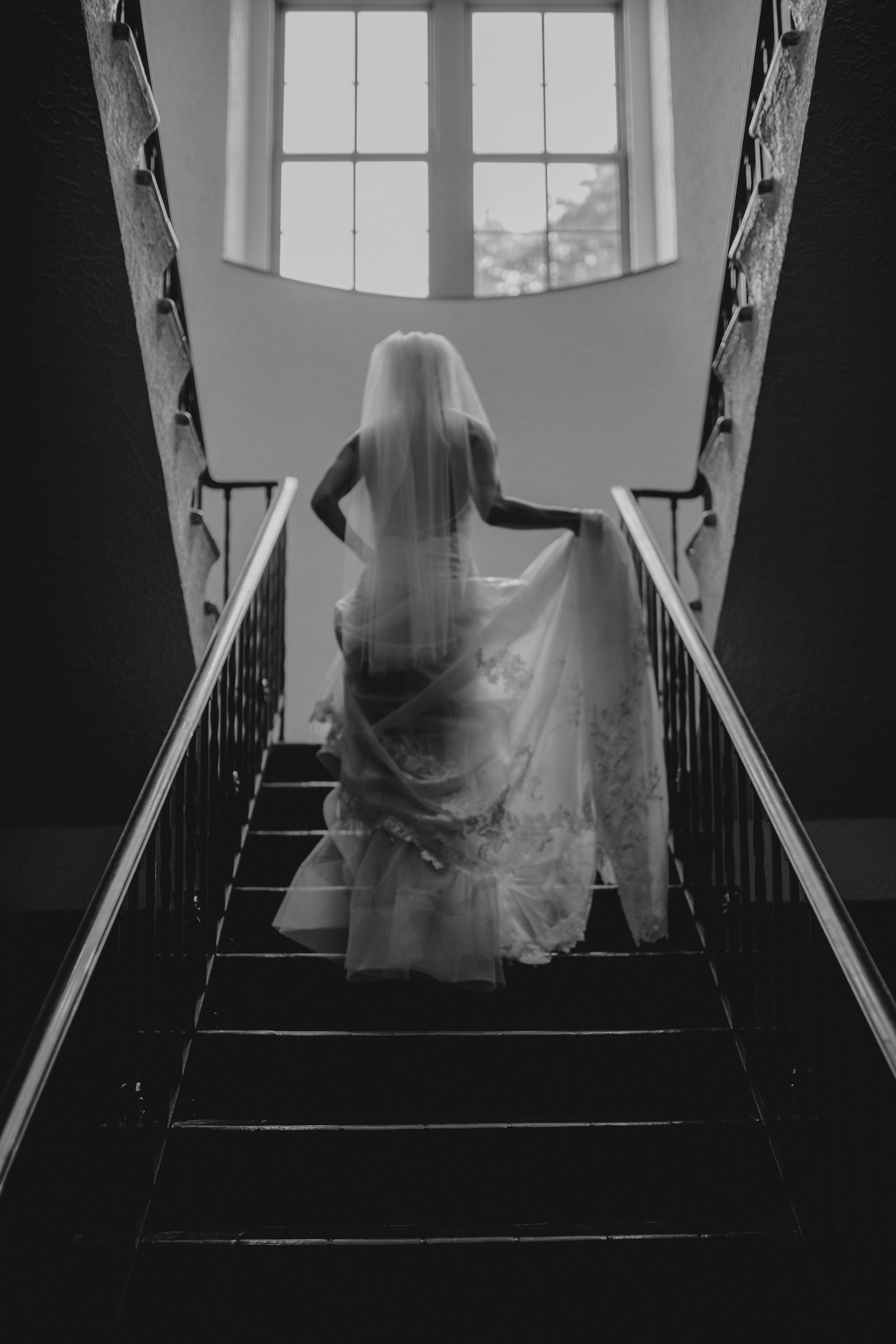 Editorial Inspired Black and White Bridal Portrait, Florida Bride and Back of Dress Detailing Before Wedding, In Staircase of The Vinoy Renaissance Hotel in Downtown St. Petersburg
