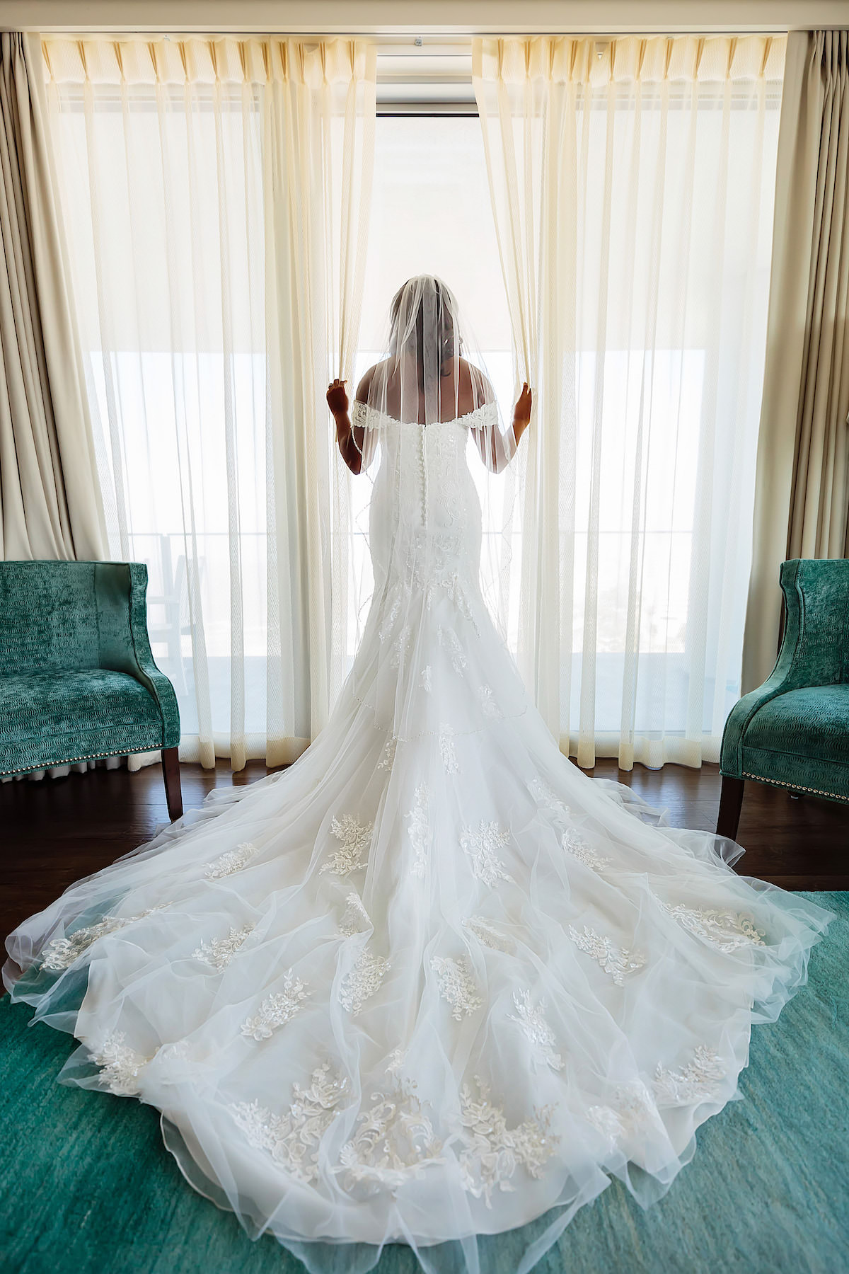 Classic Tampa Bay Bride at Window in Off the Shoulder Lace Wedding Dress