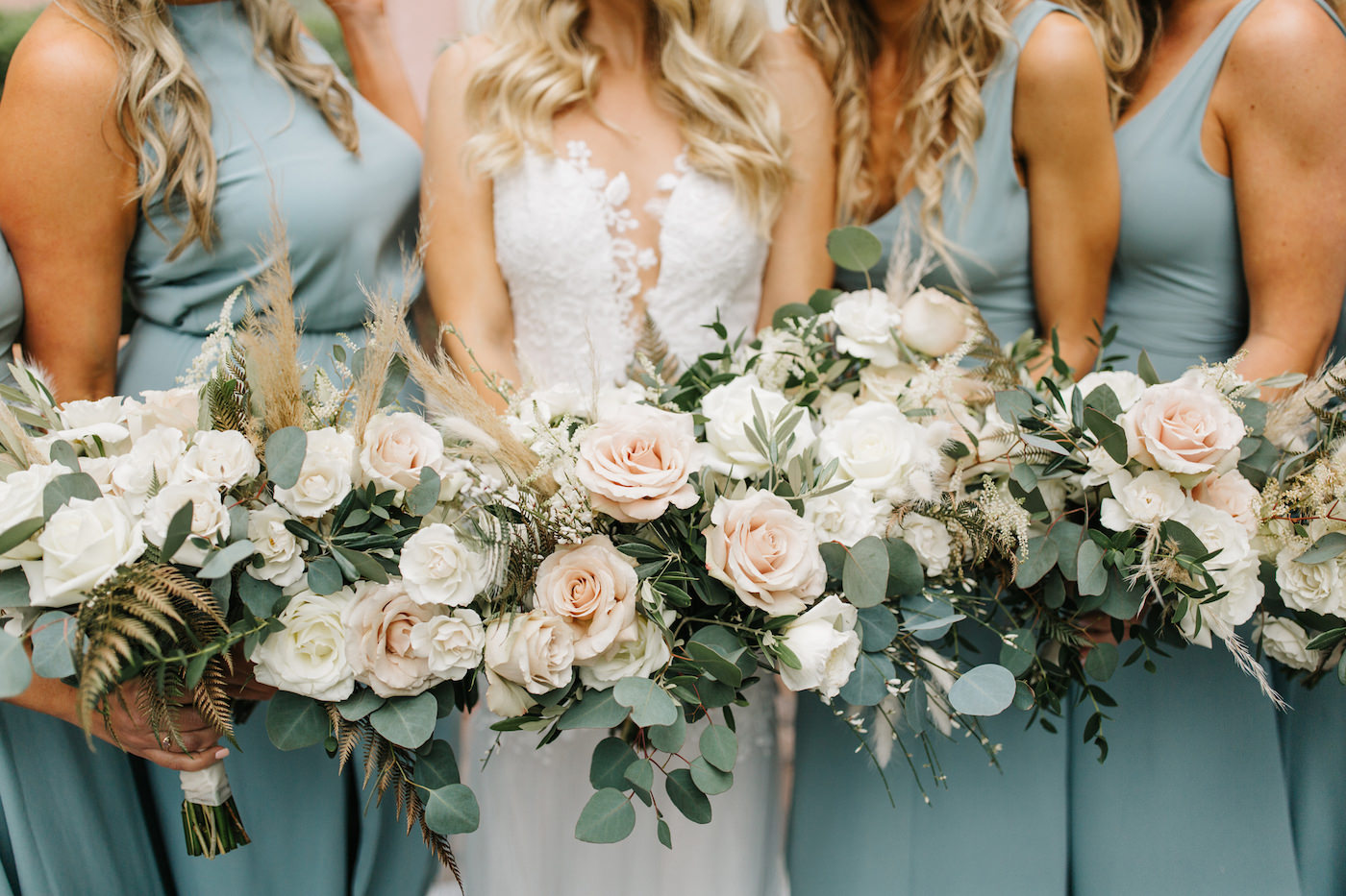 Boho Chic Inspired Bride and Bridesmaids in Long Mix and Match Show Me Your Mumu in Silver Sage, Holding Lush Ivory and Blush Pink Roses Flowers, Pampas Grass, Greenery Eucalyptus and Gold Painted Leaves Floral Bouquets | Luxury Florida Wedding and Bridal Dress Shop Isabel O’Neil Bridal Collection | Downtown St. Pete Wedding Planner Parties A’ La Carte