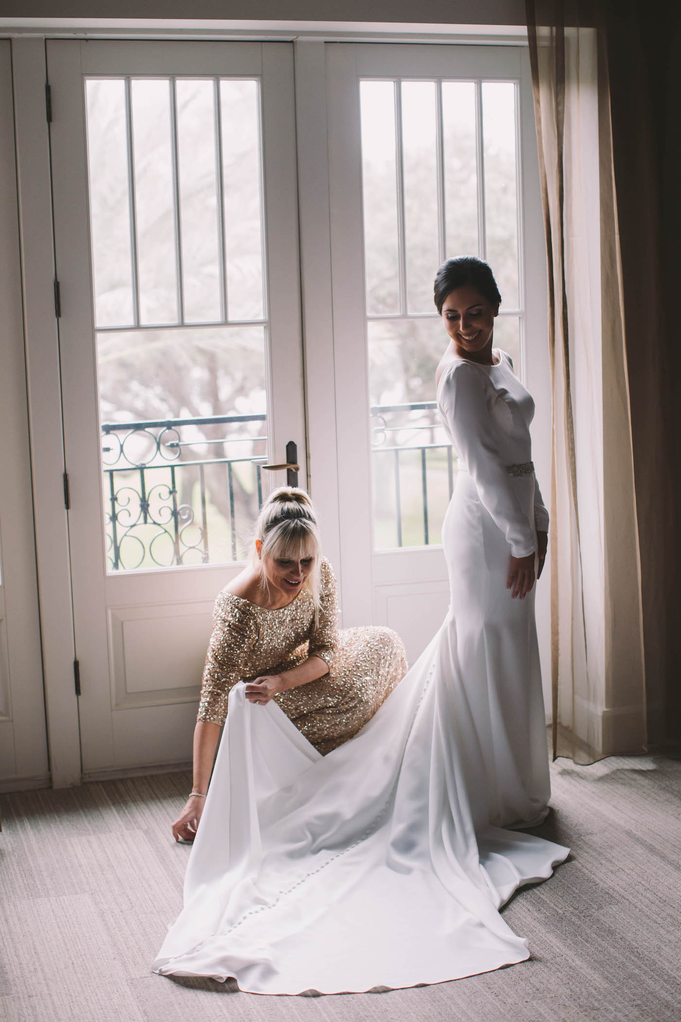 Timeless Florida Bride and Mother Getting Ready Portrait | Bride Wearing White Mikaella Bridal Wedding Dress with Swoop Scallop Neckline, Long Sleeves | Tampa Bay Boutique Hotel Wedding Venue The Birchwood