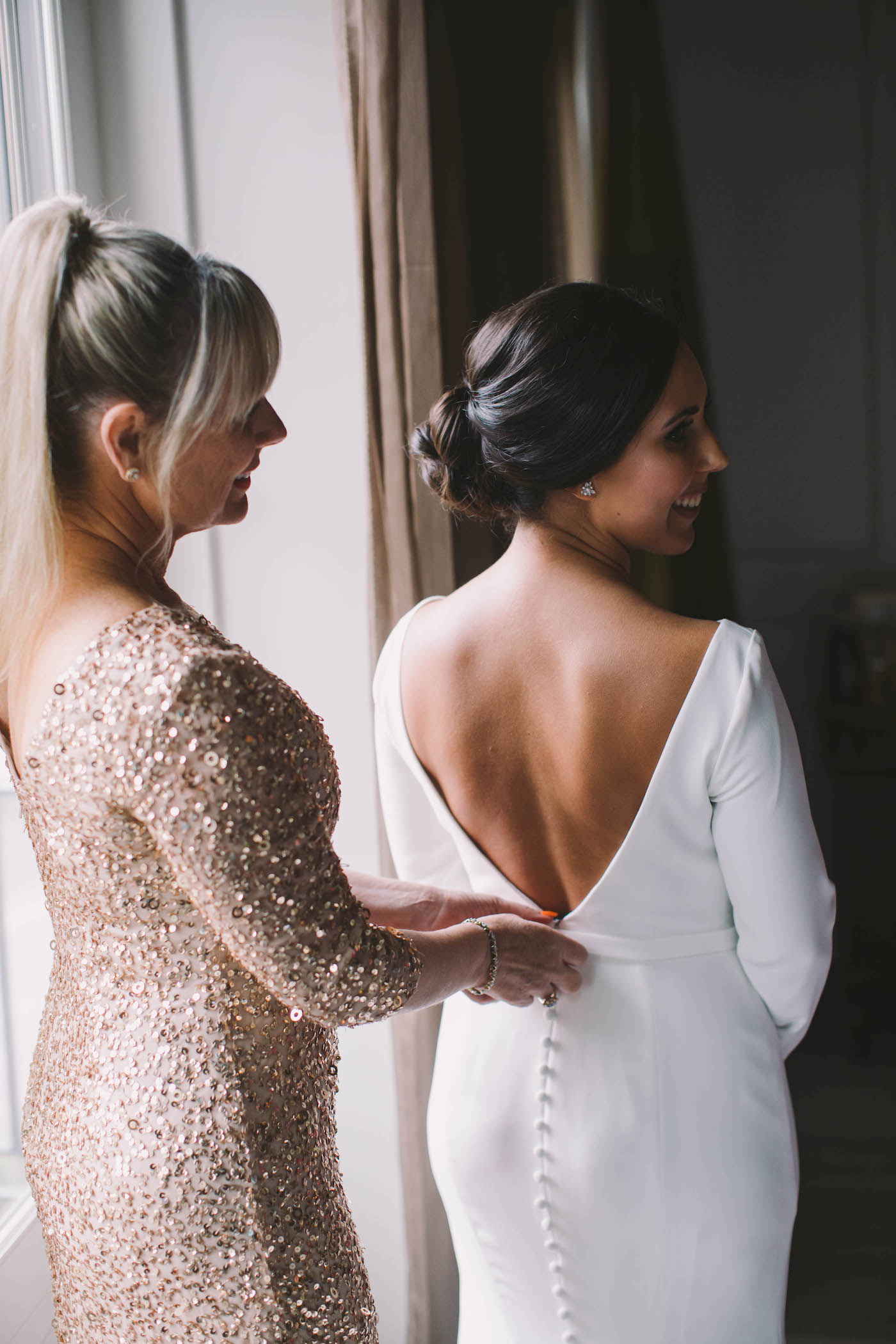 Timeless Florida Bride and Mother Getting Ready Portrait | Bride Wearing White Mikaella Bridal Wedding Dress with Open V-Back and Buttons, Long Sleeves | Tampa Bay Boutique Hotel Wedding Venue The Birchwood