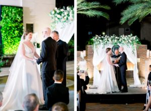 New Year's Eve Elegant Classic Nighttime Wedding Ceremony, Bride and Groom Exchanging Vows, White Draped Arch with Greenery and White Floral Arrangement, Red Brick Fireplace Backdrop | Wedding Photographer Shauna and Jordon Photography | Tampa Wedding Planner UNIQUE Weddings + Events