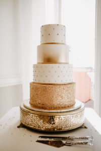 Round Four Tier Wedding Cake with Metallic Gold Embellishments on Ornate Gold Stand | Tampa Cake Bakery The Artistic Whisk
