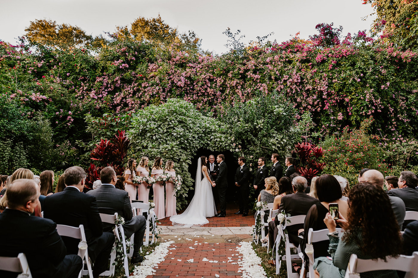 St. Petersburg Outdoor Garden Wedding Ceremony with Lush Covered Wall Backdrop | Blush Pink and White Wedding
