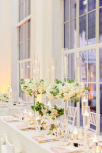 Classic Wedding Reception and Decor, Tall Candelabra Centerpieces with Lush Greenery and Ivory Flowers, Blush Pink Linens, Gold Mercury Glass, White Chiavari Chairs | Downtown Tampa Wedding Venue The Vault | Florida Wedding Planner Breezin' Weddings