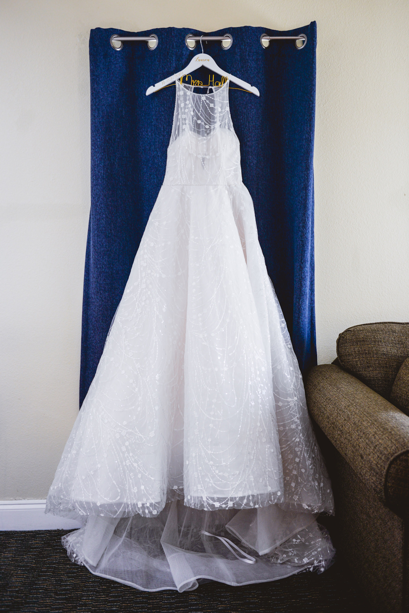 Wedding Dress Hanger Shot | White Embroidered Organza Ballgown Illusion Neck Bib Neckline Bridal Gown | Tampa Wedding Dress Shop Truly Forever Bridal