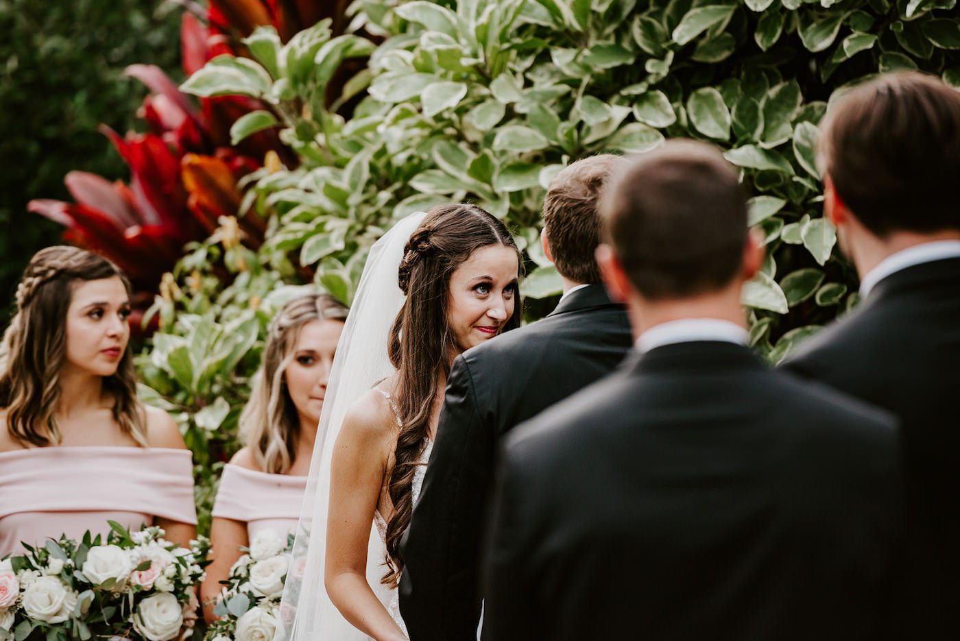 Bride and Groom Exchanging Vows during Outdoor Garden Ceremony at St. Pete Wedding
