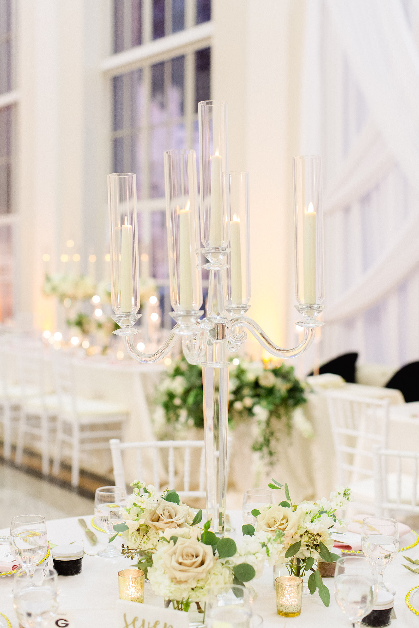 Classic Wedding Reception and Decor, Tall Crystal Candelabra Centerpieces with Greenery, Ivory Flowers, Blush Pink Roses, Gold Mercury Glass, White Chiavari Chairs | Downtown Tampa Wedding Venue The Vault | Florida Wedding Planner Breezin' Weddings