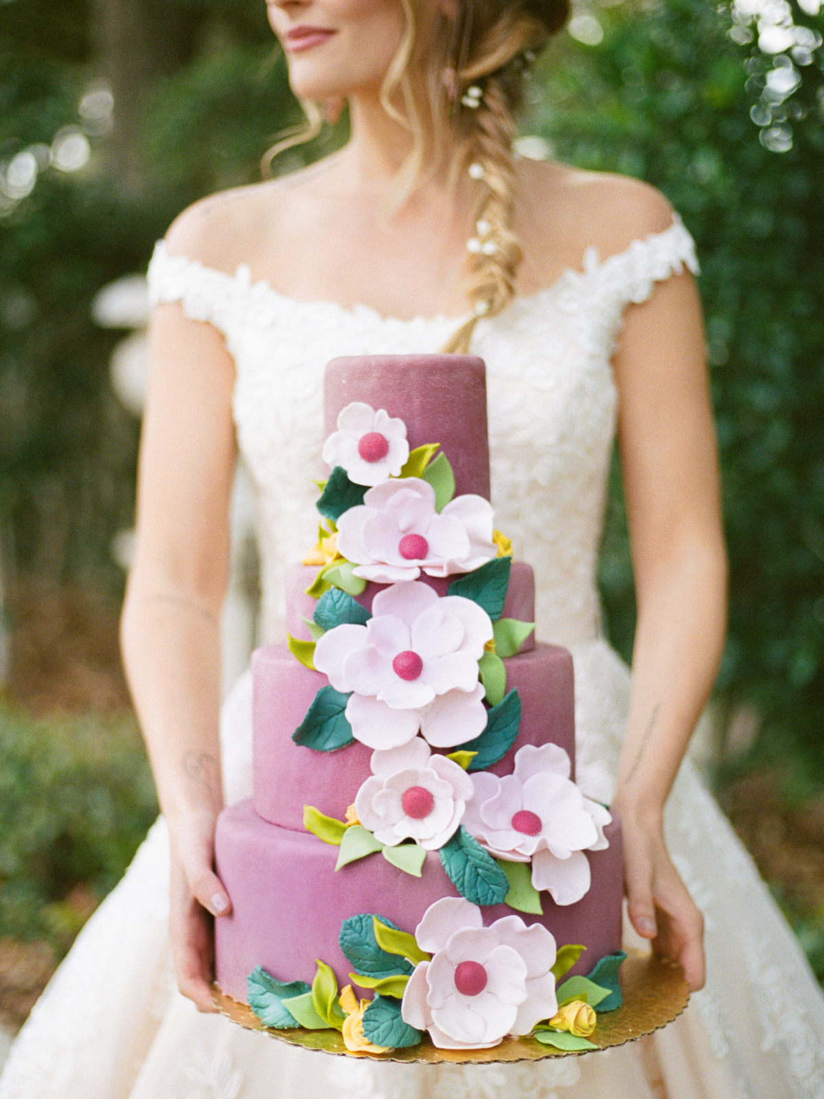 Round Four Tier Colorful Spring Wedding Cake with Pink Fondant Icing and Sugar Flower Magnolias