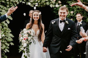 Bride and Groom Rose Petal Toss Exit during Outdoor Garden Wedding Ceremony in St. Petersburg Florida