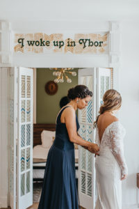 Ybor City Tampa Wedding Bride Getting Dressed | Long Sleeve Lace Wedding Dress Bridal Gown with Low Back and Buttons