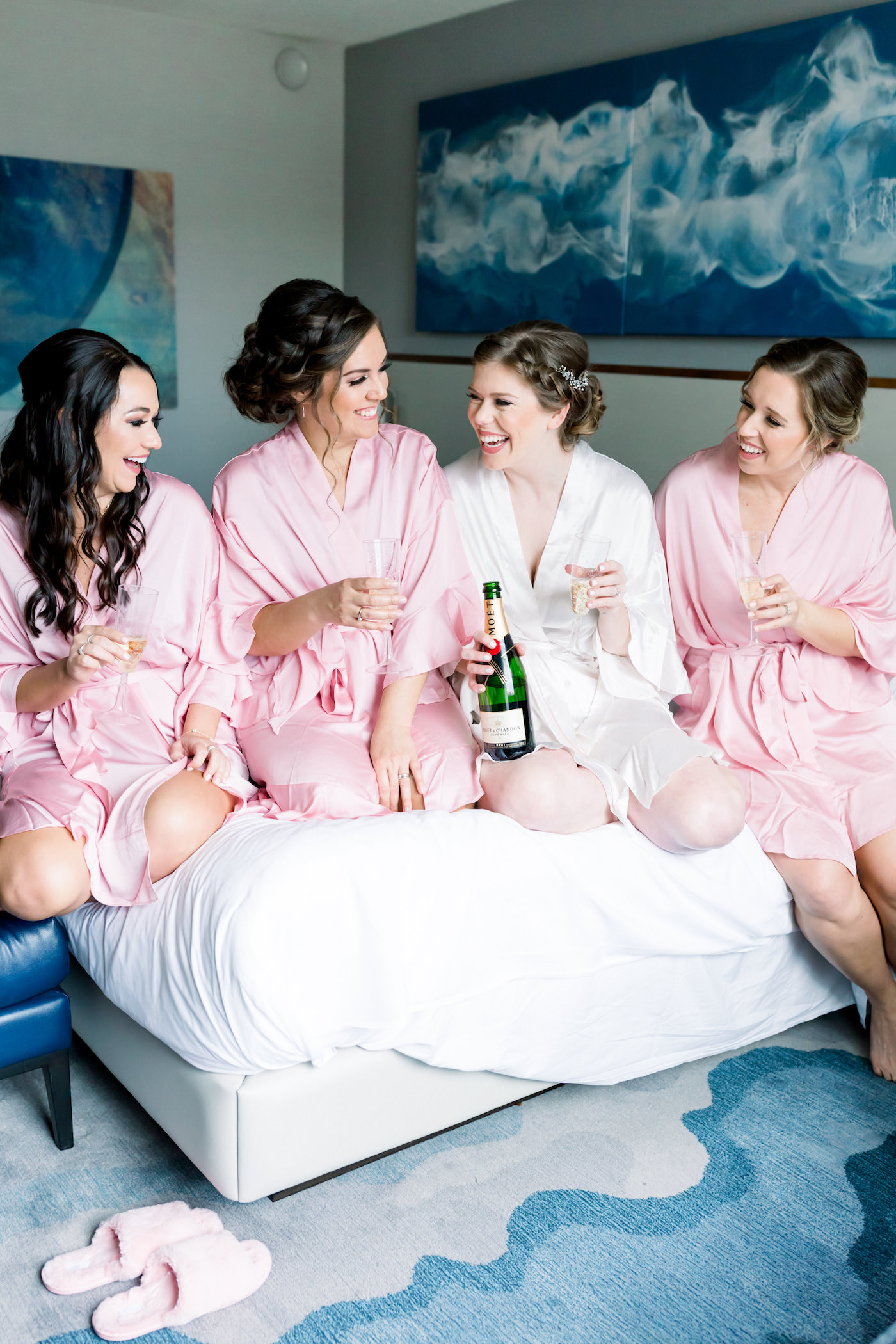 Tampa Bride and Bridesmaids in Pink Robes Champagne Cheers Getting Wedding Ready Hotel Portrait | Wedding Photographer Shauna and Jordon Photography | Wedding Hair and Makeup Femme Akoi Beauty Studio