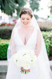 Classic Elegant Tampa Bride Beauty Portrait in Plunging V Neckline Ballgown Wtoo by Watters Wedding Dress Holding White Roses Floral Bouquet, Braided Updo, Long Veil | Wedding Photographer Shauna and Jordon Photography | Wedding Hair and Makeup Femme Akoi Beauty Studio | Wedding Planner UNIQUE Weddings + Events