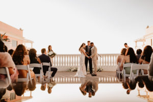 Clearwater Wedding Venue Hyatt Regency Beach Hotel | Outdoor Rooftop Waterfront Wedding Ceremony with White Garden Chairs