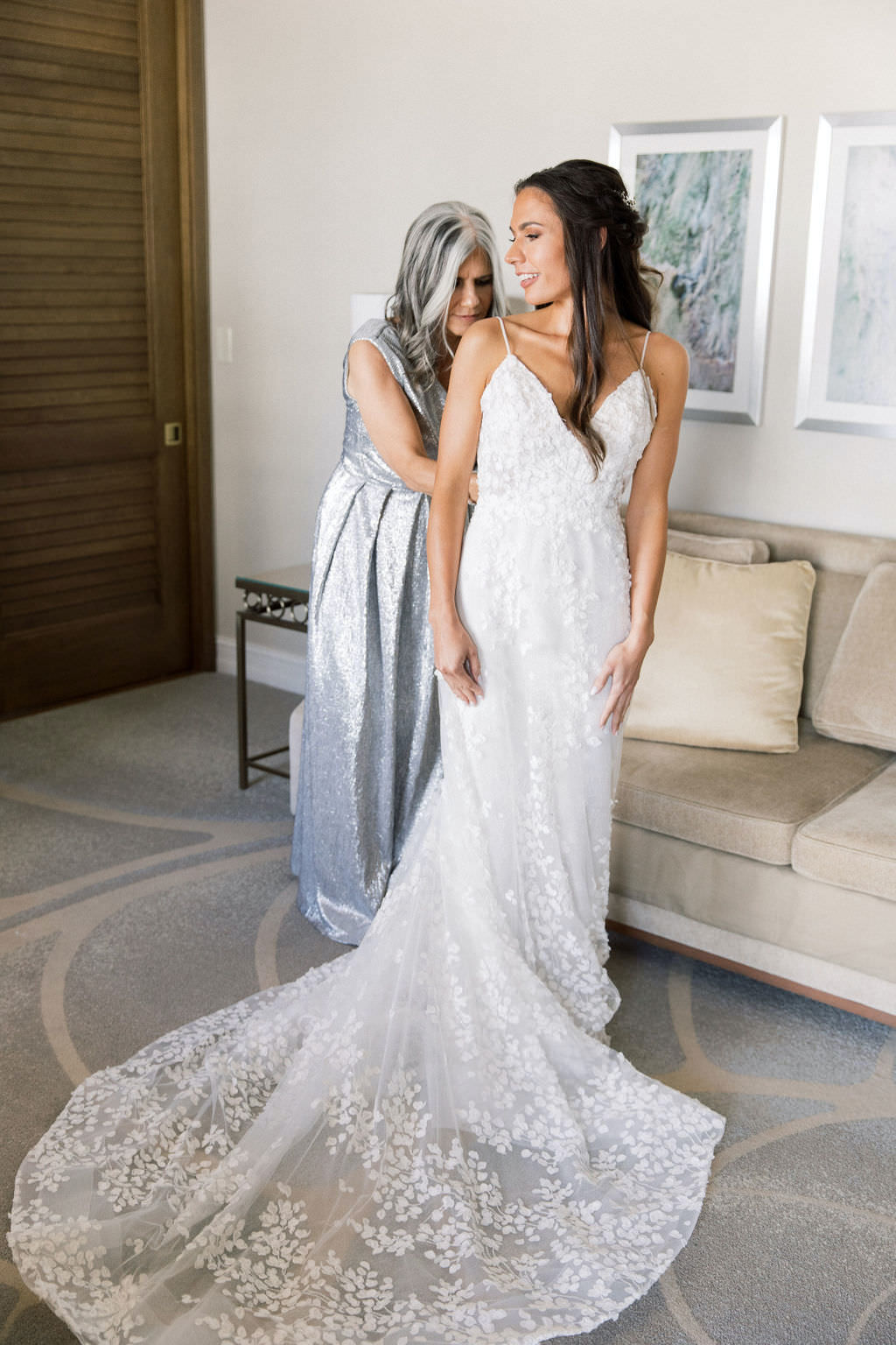 Elegant Florida Bride and Mother Getting Ready Portrait, Wearing White Spaghetti Strap Floral Lace Lazaro Wedding Dress with Train, Mother in Midnight Silver Moon Inspired Long Dress