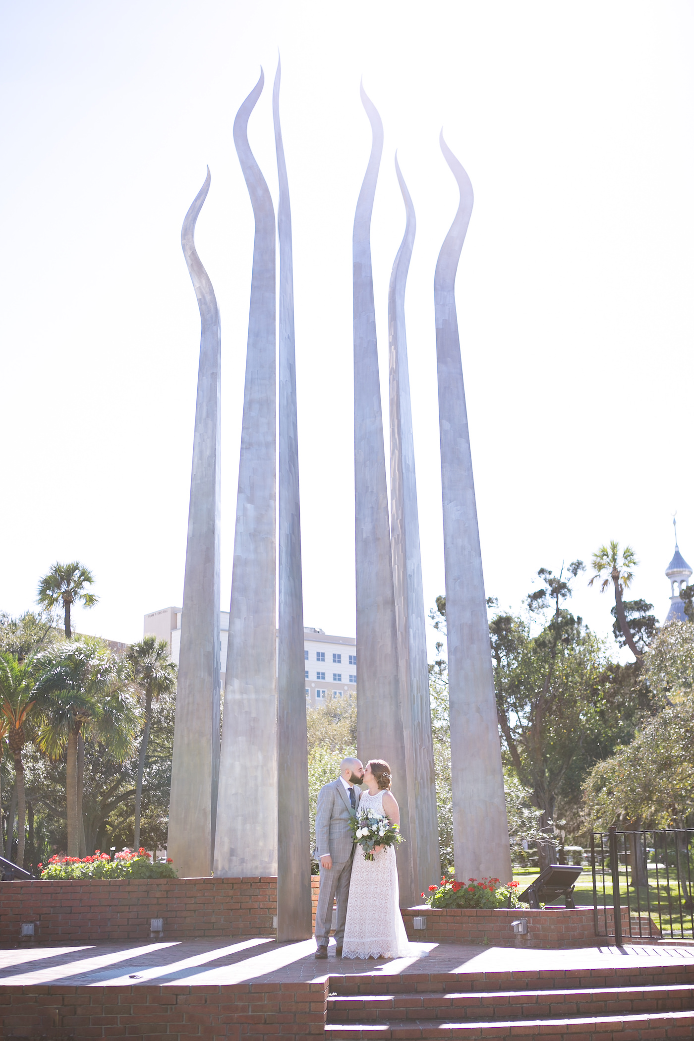 Florida Bride and Groom Portrait in Front of Sculptures at The University of Tampa | Wedding Photographer Carrie Wildes Photography