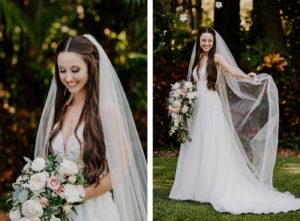 Organza and Lace V Neck Bridal Gown Wedding Dress with Cathedral Veil and Natural Loose Curls Hairstyle | Cascade Bridal Bouquet with White and Blush Pink Roses and Ranunculus, White Astilbe, Ivory Stock, Greenery and Eucalyptus | Tampa Wedding Florist Monarch Events and Design